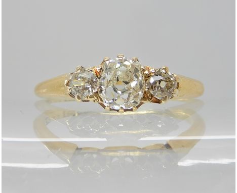 AN 18CT GOLD THREE OLD CUT DIAMOND RING of estimated approx 0.90cts, in classic crown mounts, finger size O1/2, weight 3.1gms