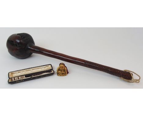 AN AFRICAN HARDWOOD KNOBKERRIE rootwood club with geometric carved grip, 41cm long, an ivory netsuke of a man seated reading,