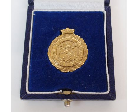 A 9CT GOLD SCOTTISH FOOTBALL ASSOCIATION SCOTTISH CUP FINAL LINESMAN'S MEDAL the obverse inscribed Scottish Football Associat