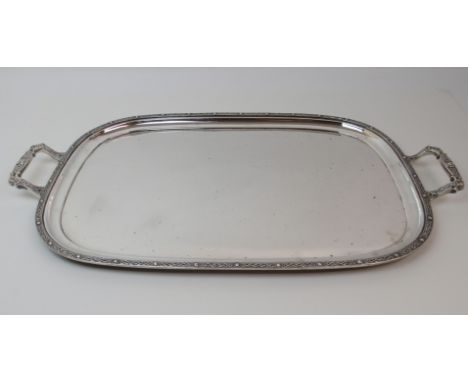 A SILVER SERVING TRAY by Frank Cobb &amp; Company Limited, Sheffield 1960, of rectangular form with Celtic decorated edge, th