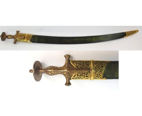 AN INDO PERSIAN TULWAR the curving fullered blade with indecipherable markings, the hilt with gilt decoration in fabric cover