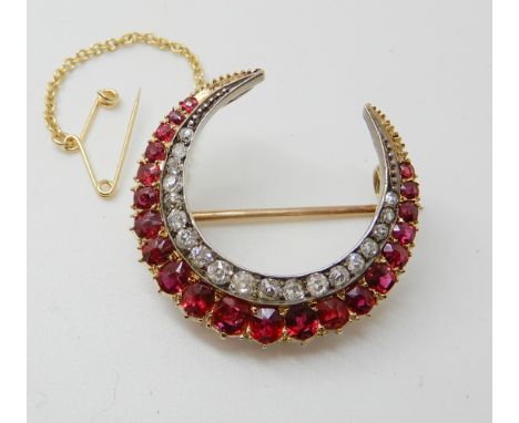 A DIAMOND AND RUBY CRESCENT MOON BROOCH set with estimated approx 0.90cts of old cut diamonds, largest ruby approx 4.2mm x 3.