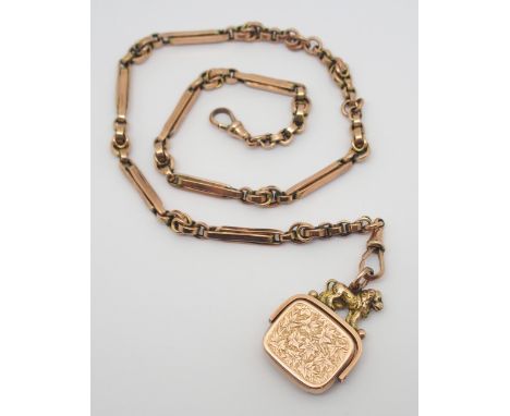 A 9CT GOLD FANCY LINK FOB CHAIN WITH ATTACHED SEAL WITH LION FINIAL chain has a soldered on 9c tag, stamped to both clasps, s