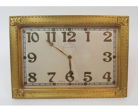 A GOLDSMITHS AND SILVERSMITHS GILT 8 DAY MANTLE CLOCK of rectangular form with Arabic numerals, the case of classical design 