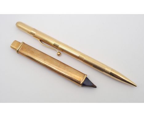 A 14K GOLD LADIES PROPELLING PENCIL WITH AND A 9CT GOLD PENCIL SLEEVE the ladies pencil has linear and horizontal engine turn
