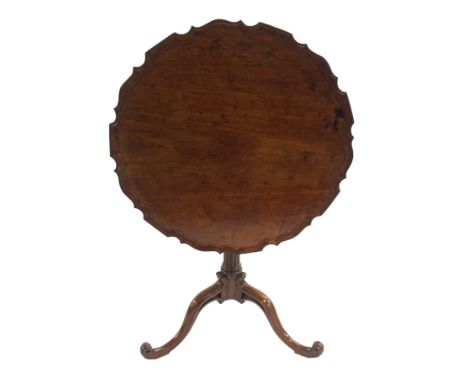 A MAHOGANY TILT-TOP TRIPOD TABLE the pie crust top above a fluted column and on scroll legs, 72cm high x 76cm diameter Condit