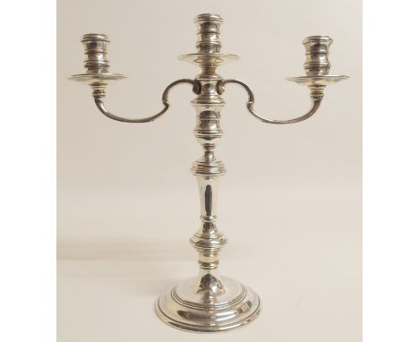 A SILVER THREE-LIGHT CANDELABRUM by William Comyns &amp; Sons Limited, London 1973 with double knopped stem on stepped pedest