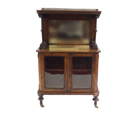 A VICTORIAN WALNUT AND INLAID MUSIC CABINET with brass three quarter gallery above a mirror back and with a pair of glazed do