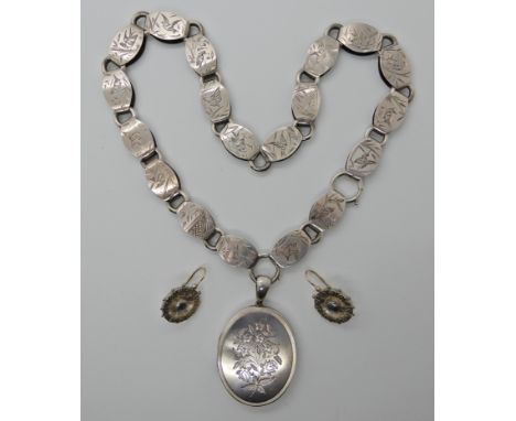 A VICTORIAN WHITE METAL LOCKET AND CHAIN the chain engraved to every link with birds and butterflies in the oriental style, l