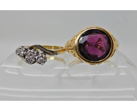 TWO VINTAGE RINGS an 18ct gold scroll mount ring set with a garnet, of approx 10mm, finger size approx L,  hallmarked Chester