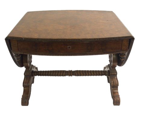 A GERMAN BURR WALNUT SOFA TABLE the oval top with beaded edge above a single drawer and turned finials on lyre shaped support