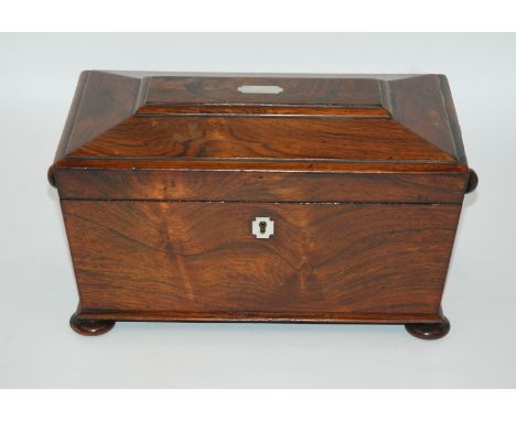 A VICTORIAN ROSEWOOD SARCOPHAGUS SHAPED TWO DIVISION TEA CADDY with mother of pearl inset with hinged lid and with glass mixi