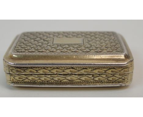 A SILVER VINAIGRETTE by John Shaw, Birmingham 1813, of rectangular form with engine turned decoration, the hinged cover openi