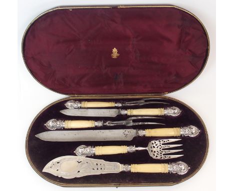 A CASED VICTORIAN SILVER CARVING AND FISH SERVING SET by Harrison Brothers & Howson, Sheffield 1880, the pair of fish servers