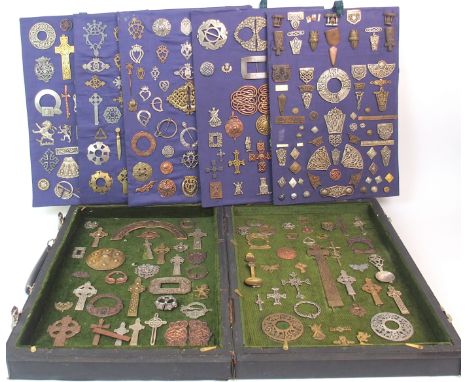 AN EXTENSIVE COLLECTION OF CELTIC BADGES sporran mounts, pen-annular brooches etc mounted on cards in a carry case Condition 