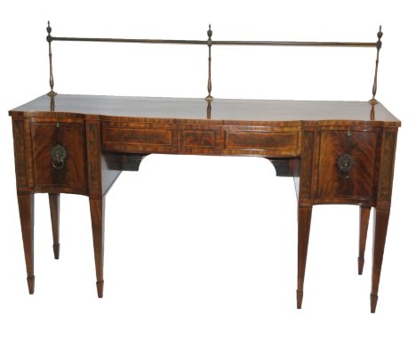 A GEORGE III STYLE MAHOGANY AND INLAID SERPENTINE SIDEBOARD with brass curtain rail above two central drawers flanked by two 