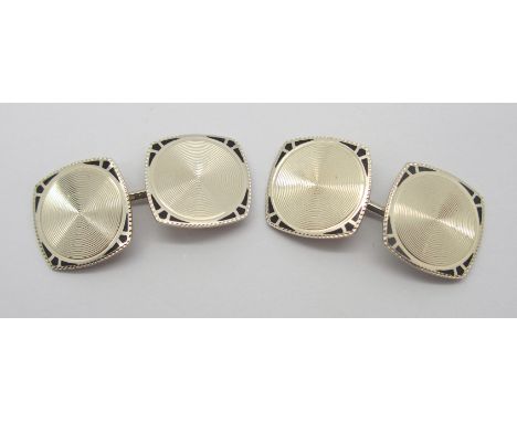 A PAIR OF 14CT WHITE GOLD AND BLACK ENAMEL ART DECO STYLE CUFFLINKS with engine turned decoration, head size approx 1.3cm eac