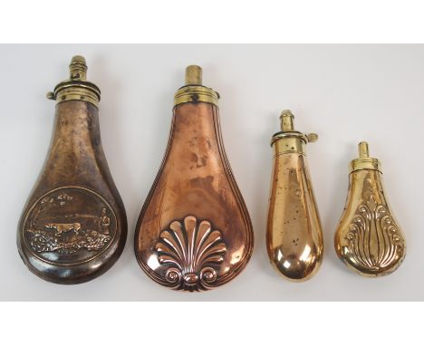 A COPPER AND BRASS SHOT FLASK embossed with a hunting scene, 19cm long, with three other similar shot flasks (4) Condition Re