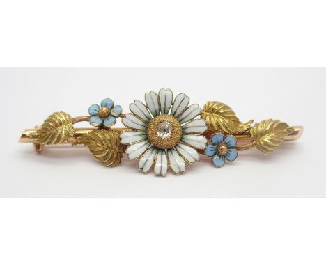 A BRIGHT YELLOW METAL ENAMEL AND DIAMOND FLOWER BROOCH depicting forget me nots and a daisy set with an old cut diamond of es