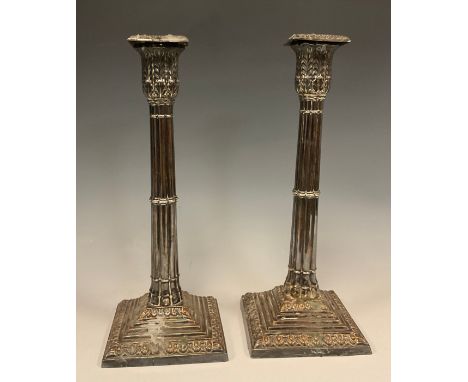 A pair of late 19th century George III style silver plate candlestick, neoclassical stacked columns with acanthus capitol, st