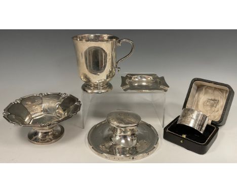 A silver bell shaped mug, London 1902, 6.48ozt; pedestal sweetmeat bowl, london 1931, 2.96ozt; cased napkin ring, Sheffield 1