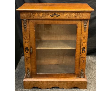 A Victorian inlaid walnut Pier Cabinet, large glazed door enclosing single shelf, gilt brass mounts, stepped base with shaped