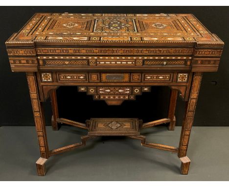 An early 20th century Middle Eastern Damascus games table, typical intricate marquetry inlay in exotic hardwoods, and mother-