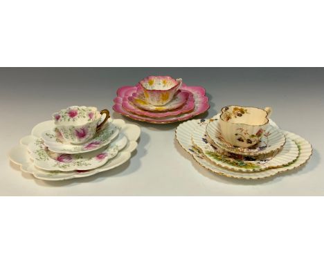 A group of three Wileman and Company tea trios including; 'Chrysanthemum' pattern, no. 6891, empire-shaped tea cup trio, conf