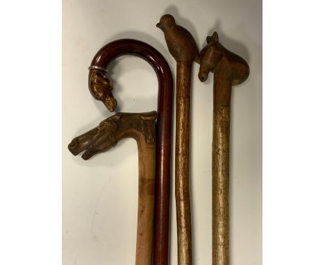 Walking sticks - two folk art walking sticks, bird and horses head terminals; others, one carved with a horses head the other