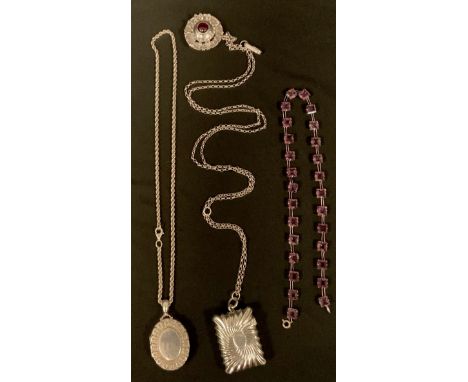 A Victorian silver vesta case, Sheffield 1894, suspended from a later agate and white metal guard chain necklace; silver oval