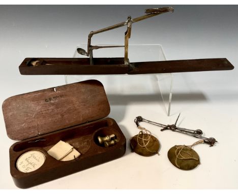 A George III apothecary scale, in a mahogany case, c.1800; a travelling guinea scale, labelled Daniel Robinson, Prescot, Lanc