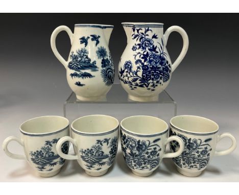 An 18th century Worcester porcelain sparrowbeak cream jug, similar larger jug, four coffee cups, all decorated in the fence p