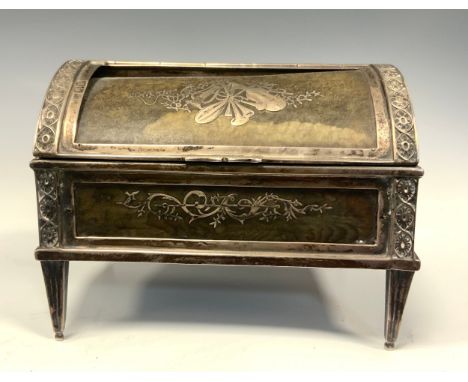 An Edwardian silver and tortoiseshell dome-top table trinket box, the ornate case silver frame inset with eight tortoise shel