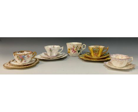 A group of three Wileman and Company tea cup trios; a 'Thistle' pattern, no.7018, snowdrop-shaped tea cup trio,c.1898, a 'Dre