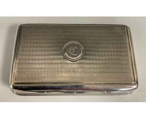 A George III silver rounded rectangular snuff box, engine turned overall, hinged cover, gilt interior, 7.5cm wide, Matthew Li