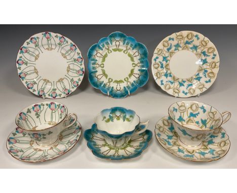 A group of  three Wileman and Co. trios; pattern 'Anenous' no.7367, shape 'Gainsbourough'c.1902; pattern 'Petunia', no.7069, 