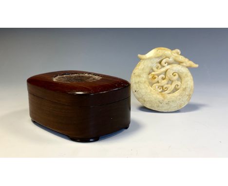 A Chinese jade roundel, carved with a phoenix, 8.5cm diam; a Chinese hardwood rounded rectangular box and cover, shallow brac