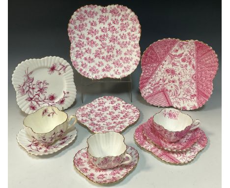 A Wileman and Company 'Thistle' pattern, no.3698,tea cup trio with a conforming cake plate,c.1887; 'Dolley Varden' pattern, n