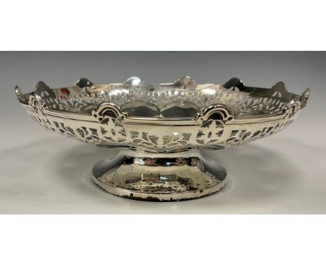 A silver shaped circular pedestal sweet meat bowl, the undulating sides with stylised flowerheads and pierced lip, 18cm diame