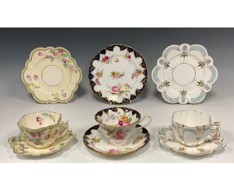 A Group of three Wileman and Co. trios; pattern ' Planel of decoration', daisy-shaped tea cuop trio,c.1890; pattern 'Hawforn 