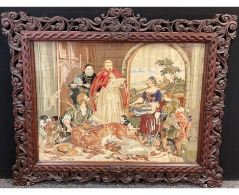 A Large Gothic style carved walnut frame, early to mid 20th century, 121cm high x 143cm wide overall, with tapestry. 