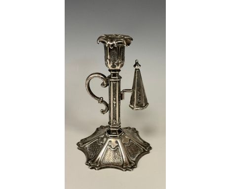 A Victorian silver Gothic Revival chamberstick, floral sconce, hexagonal column, scrolling handle, above embossed base with a