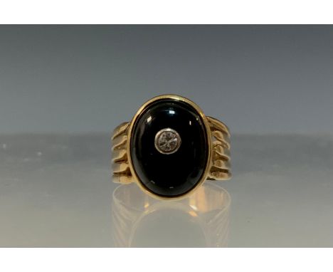 A diamond and black onyx signet ring, oval black onyx cabochon inset with a single round brilliant cut diamond, ridged open c