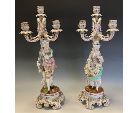 A pair of German porcelain three-light figural candelabra, 50cm high, c.1900 
