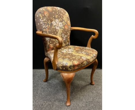 A Queen Anne design walnut armchair, tapestry upholstered back and seat, serpentine shaped arms, cabriole legs, 19th century,