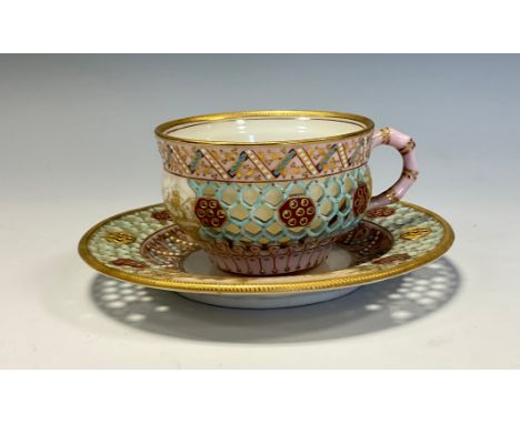 A Royal Worcester reticulated cup and saucer, attributed to George Owen, the saucer 11cm diam, printed marks, c.1880 
