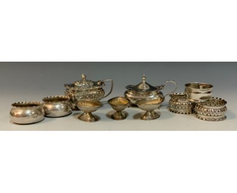 An assortment of silver including; a George V silver mustard pot,Birmingham, 1918; a pair of Edwardian napkin rings, William 