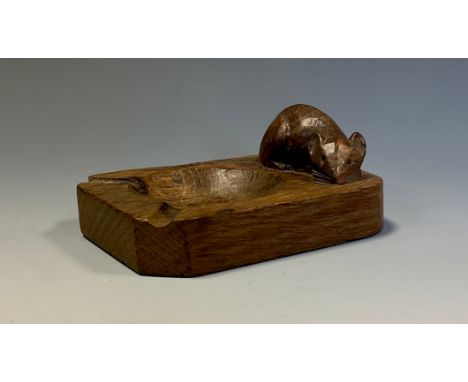 Robert Thompson, Mouseman of Kilburn, an oak ashtray, adzed overall, carved mouse signature, 10cm long 