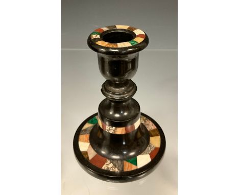 An Ashford Marble boudoir candlestick, inlaid with bands of specimen stone to top, middle, and base, 11.5cm high. 