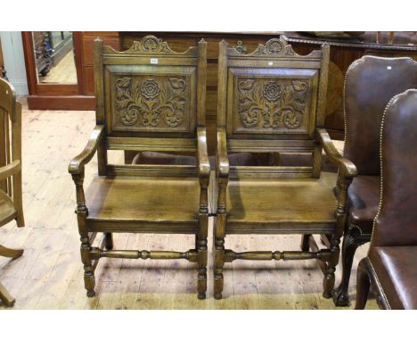 Pair oak carved panel back open armchairs